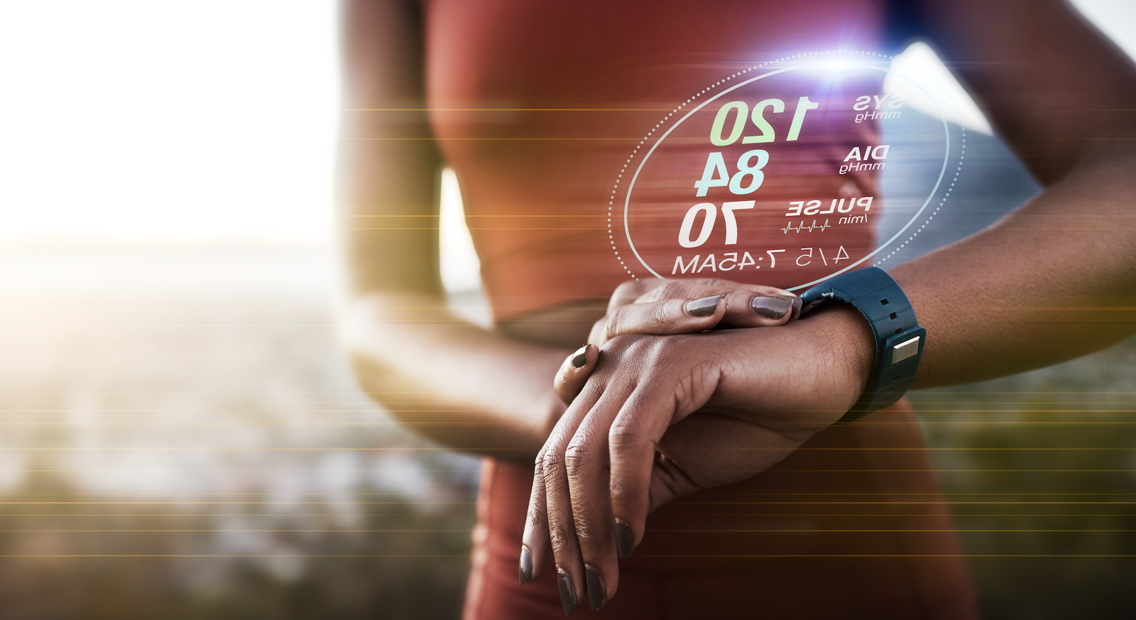 Woman wearing a fitness tracker smartwatch to monitor health data and performance